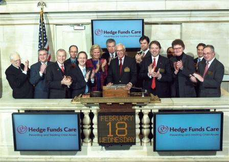 Representatives of Seward & Kissel and Hedge Fund Care ringing the opening bell at the New York Stock Exchange